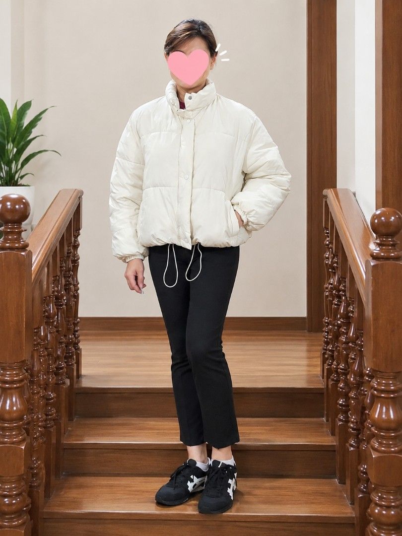 Off-White Cropped Puffer Jacket with Drawstring Hem (Category: Coats, Jackets and Outerwear) located in Paranaque City. Submitted by ccc_finds (Listing ID 1459822550, Image 3). Description: • Off-white cropped puffer jacket • Drawstring hem for adjustable fit • Button-up front with convenient pockets • Measurements: Shoulder - 20 in. Chest width - 24 in. Jacket length - 21 in. Sleeve length - 22 in. Arms sleeve width - 9 in. • Condition: Used onc