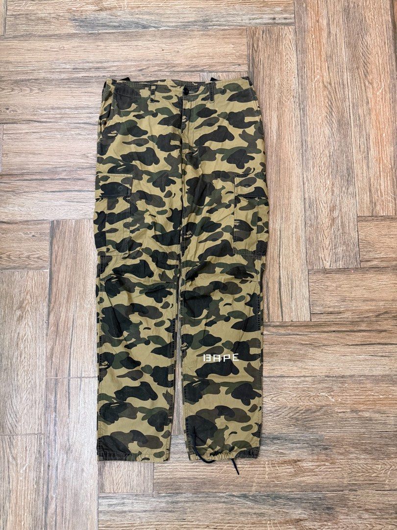 OG BAPE 1st Camo Cargo Pants (Category: Jeans) located in Manila. Submitted by sleamdaily222 (Listing ID 1460888400, Image 1). Description: - Classic BAPE camo cargo pants - Features multiple pockets - Adjustable drawstring at the ankles - Iconic BAPE camo pattern - Perfect for casual streetwear looks - A must-have for any collection.