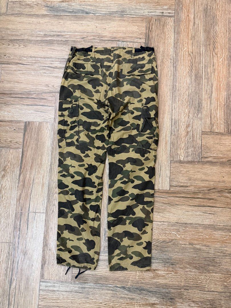 OG BAPE 1st Camo Cargo Pants (Category: Jeans) located in Manila. Submitted by sleamdaily222 (Listing ID 1460888400, Image 2). Description: - Classic BAPE camo cargo pants - Features multiple pockets - Adjustable drawstring at the ankles - Iconic BAPE camo pattern - Perfect for casual streetwear looks - A must-have for any collection.