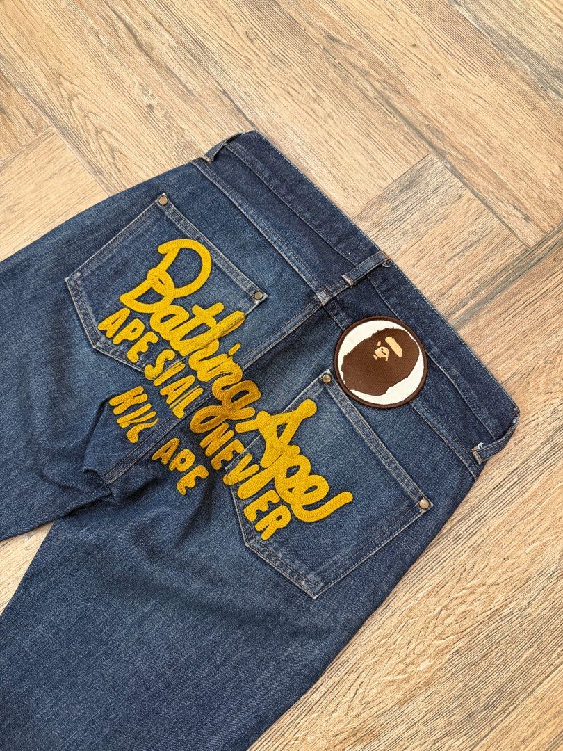 OG BAPE ASNKA EMBROID JEANS (Category: Jeans) located in Manila. Submitted by sleamdaily222 (Listing ID 1460886538, Image 3). Description: - Authentic A Bathing Ape (BAPE) dark wash denim jeans. - Features iconic yellow BAPE logo embroidery on back pockets. - Includes signature ape head patch. - Classic straight leg fit. - Perfect statement piece for any streetwear enthusiast..
