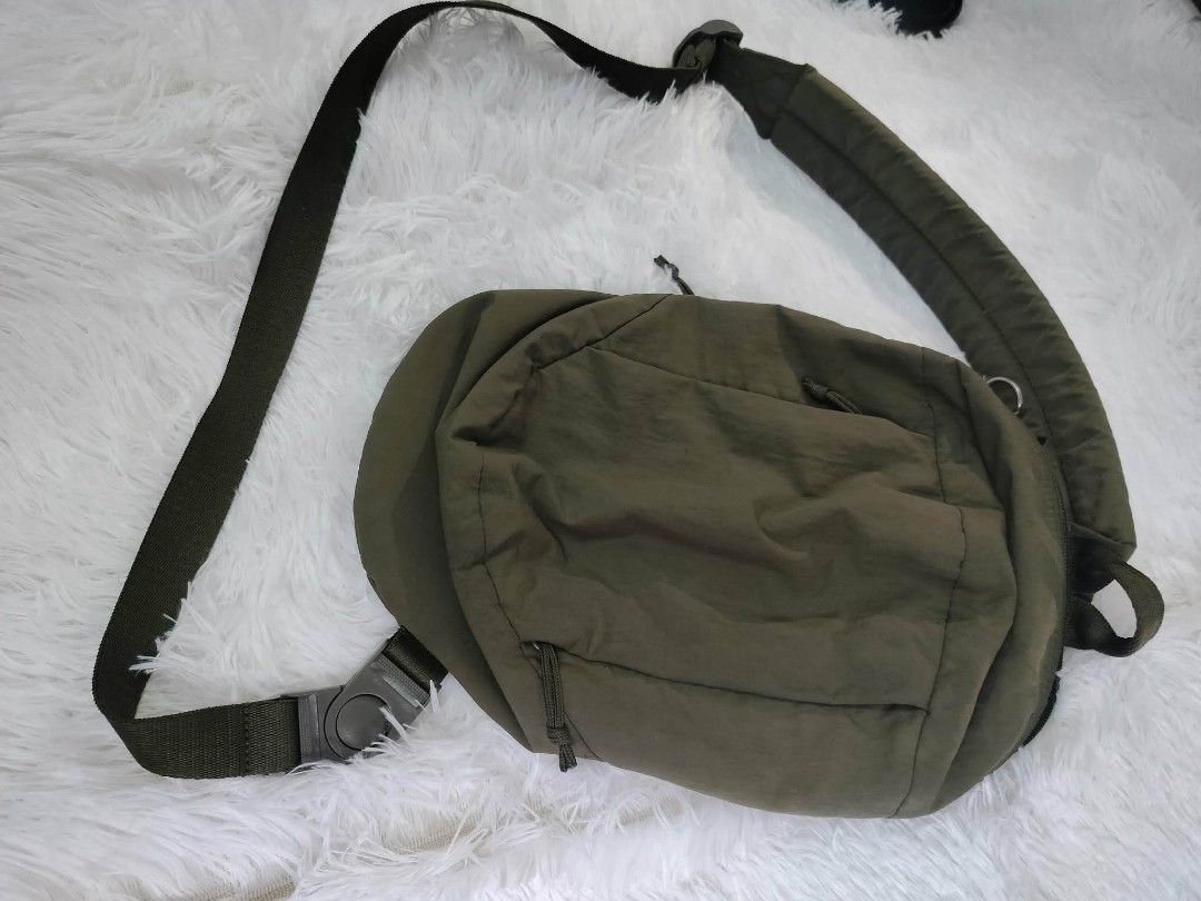 Olive Green Nylon Sling Bag (Category: Cross-body Bags) located in Cavite. Submitted by karrina06 (Listing ID 1460894110, Image 1). Description: - Olive green nylon sling bag - Adjustable strap with buckle closure - Front zip pocket for easy access - Padded strap for maximum comfort - Ideal for everyday use and carrying essentials.