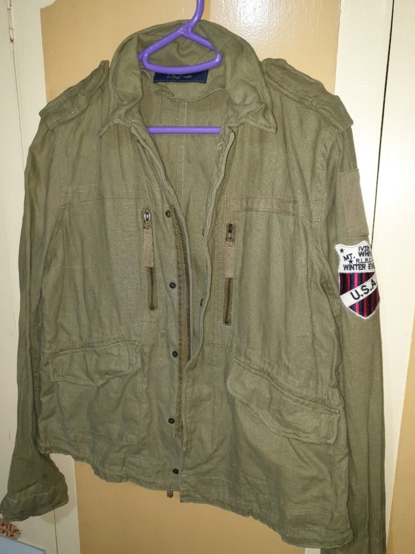 Olive Green Utility Jacket with Patches (Category: Coats, Jackets and Outerwear) located in Quezon City. Submitted by nanacoconut (Listing ID 1460830383, Image 2). Description: - Olive green utility jacket - Zip and button closure - Two zipped chest pockets - Two larger bottom pockets - 'USA Winter Event' patch on left sleeve - Ideal for casual wear Size: M-L Origin country: S. Korea.