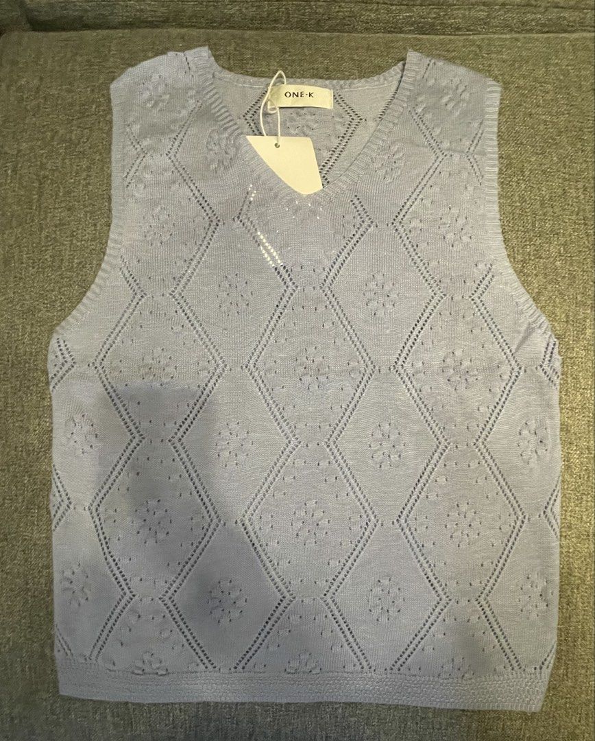 One K BKK Knit V-Neck Sleeveless (Category: Blouses) located in Quezon City. Submitted by mfordma (Listing ID 1460908491, Image 1). Description: BRAND NEW Originally bought for 480.00 Doing a little closet decluttering! ✨ Letting go of some pieces that are still in great condition and looking for a new home. 🤍 Brand: ONE-K Size: Free size Color: Powder/Light Blue Description: - Very stretchable soft knit V-neckline sleeveless design - Features a