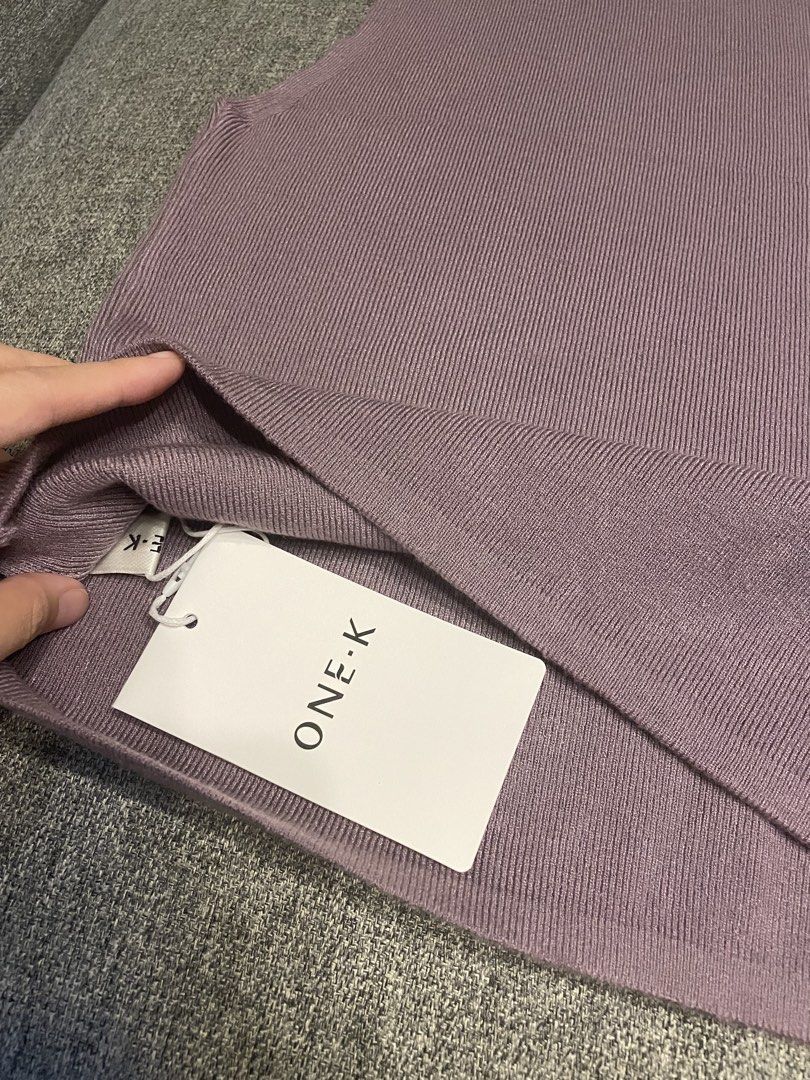 One K BKK Ribbed Turtle Neck Sleeveless (Category: Blouses) located in Quezon City. Submitted by mfordma (Listing ID 1460909331, Image 2). Description: BRAND NEW Originally bought for 480.00 Doing a little closet decluttering! ✨ Letting go of some pieces that are still in great condition and looking for a new home. 🤍 Brand: ONE-K Size: Free size Color: Mauve Description: - Very stretchable ribbed soft knit sleeveless mock neck design Measurement