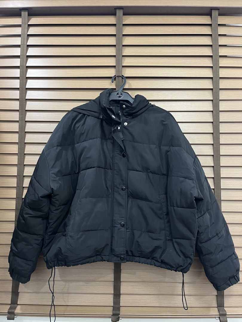 One Way Black Puffer Jacket with Hood (Category: Coats, Jackets and Outerwear) located in Mabalacat. Submitted by fashionclothesph (Listing ID 1460834327, Image 1). Description: - Length23 width27 - Black puffer jacket from One Way - Hooded design - Zip-up front with button closures - Adjustable drawstring hem - Padded for warmth - Ideal for cooler weather - Versatile and easy to style.