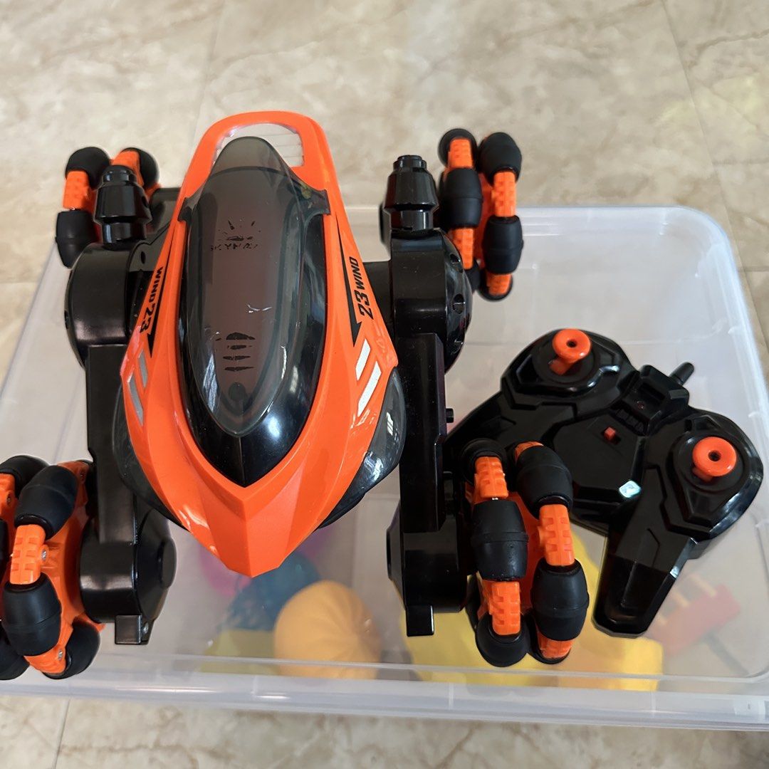 Orange & Black RC Stunt Car with Remote (Category: Remote Control Toys) located in Kawit. Submitted by wevibevintage (Listing ID 1460761750, Image 2). Description: Missing battery and charger Pwede mabili sa orangeapp Malakas makina po neto. .