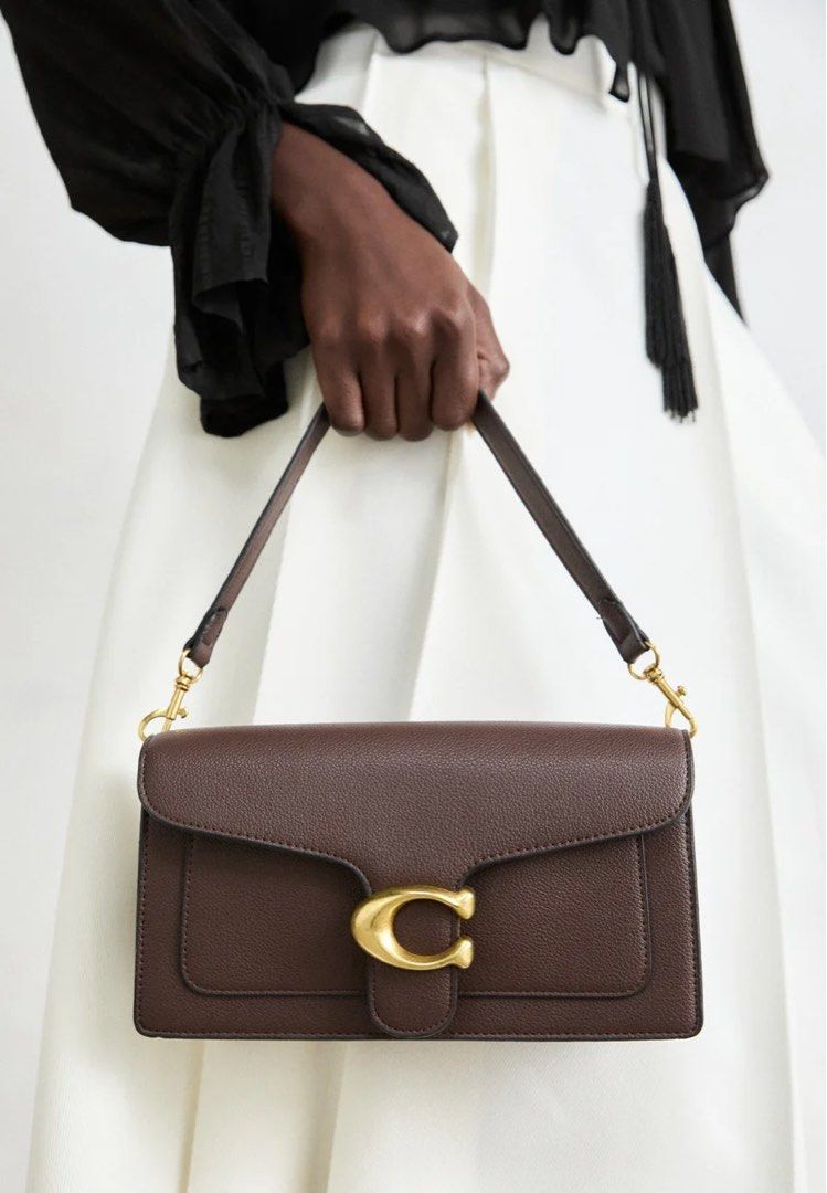 💯ORIGINAL COACH TABBY 26 MAPLE SHOULDER BAG (Category: Shoulder Bags) located in Quezon City. Submitted by ashongsstore (Listing ID 1460721535, Image 2). Description: ✨ COACH TABBY 26 — PEBBLED LEATHER ✨ A true Coach classic that deserves a spot in every bag collection. 👜🤎 Available in BLACK 🖤 & MAPLE 🍁 — two timeless shades that are so easy to style! The Tabby 26 gives you that perfect combination of structured elegance + everyday versatili