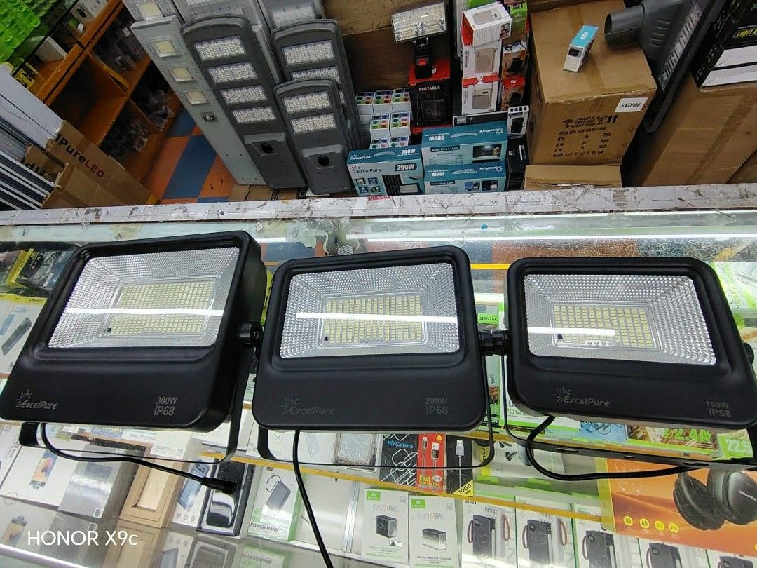 Original ExcelPure 300W Solar Flood Light with Remote Control (Category: Lighting) located in Manila. Submitted by iliasjen3082126 (Listing ID 1460773144, Image 2). Description: - ExcelPure 300W Solar Flood Light - Includes 6V/20W Solar Panel - Features 3.2V 15AH LiFePO4 Battery - IP68 Water Resistant - ON/OFF/AUTO Modes - Remote Control Included - Ideal for Outdoor Lighting 100 watts-1200 200 watts-1500 300 -2000.