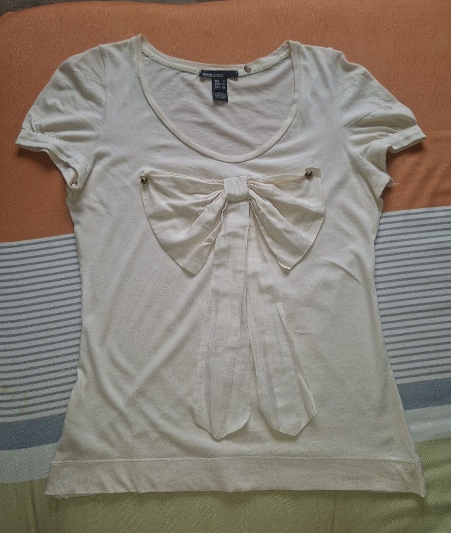 Original Mango (Category: Blouses) located in Rodriguez. Submitted by jsfashionolshop (Listing ID 1460741552, Image 1). Description: Mango Basics blouse with a bow detail and puff sleeves color cream Size Small.