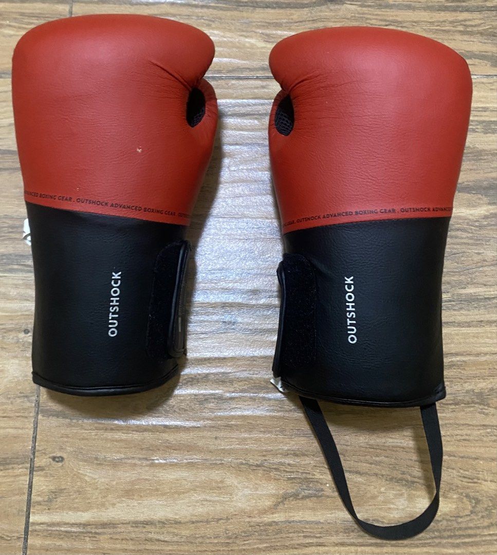 Outshock Red & Black 8oz Boxing Gloves 100 (Category: Combat Sports) located in Calamba. Submitted by declutter187 (Listing ID 1460734340, Image 1). Description: - Outshock 8oz Boxing Gloves - Color: Red and Black - Model: 100 - Material: PU and Mesh - Closure: Velcro strap for secure fit - Ideal for: Training or Sparring RFS: Decluttering, no longer using.