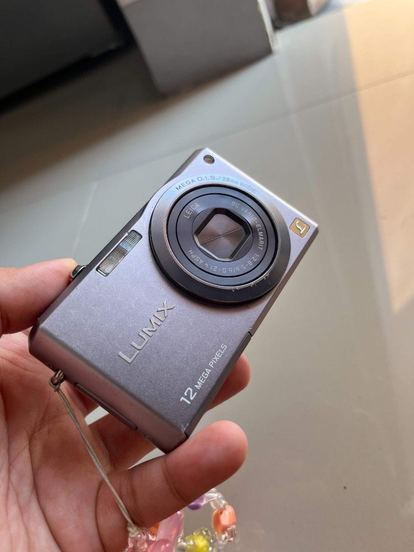 Digi Cam Panasonic Lumix (Category: Cameras) located in Manila. Submitted by bcrsd (Listing ID 1460795721, Image 2). Description: - Panasonic Lumix Digital Camera - 12 Megapixels - High-quality Leica Lens - Screen functions for photo review - Ideal for casual photography - Ready for its next owner.