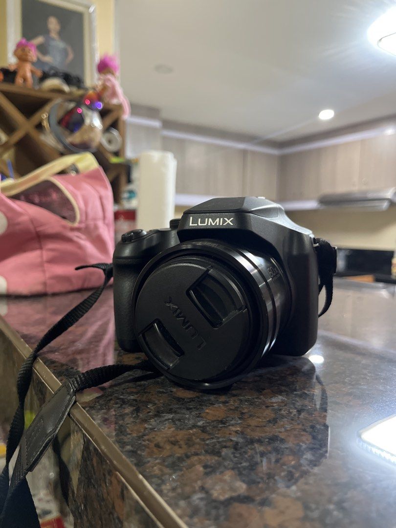 Panasonic Lumix Digital Camera (Category: Cameras) located in Manila. Submitted by newshark_db9669 (Listing ID 1460766208, Image 1). Description: - Panasonic Lumix digital camera - Black body with strap - Lens cap included - Ideal for everyday photos and travel - User-friendly controls on the back - Ready for your next adventure bought for 21K negotiable price with type C charger.