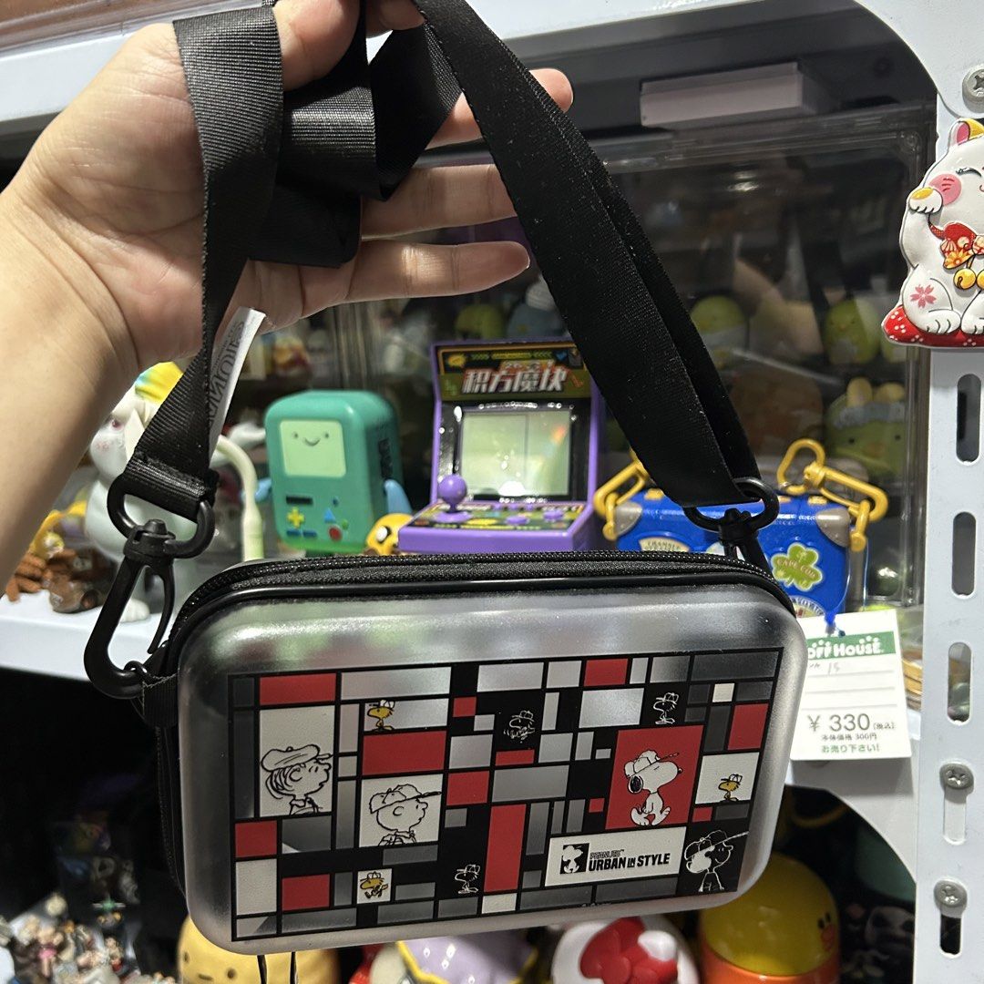 Peanuts Snoopy Hard Case Sling Bag (Category: Cross-body Bags) located in Quezon City. Submitted by kitsune.treasures (Listing ID 1460861439, Image 3). Description: *First to pay policy! *1 day reservation only. Failure to pay on time, auto cancel. 📍Quezon City * MOD: J&T | Lalamove * MOP: GCASH | BPI 📦ON HAND AND READY TO SHIP! CONDITION: WHAT YOU SEE IS WHAT YOU GET. Dimensions: Kindly check the photos for the actual measurements. Please chec