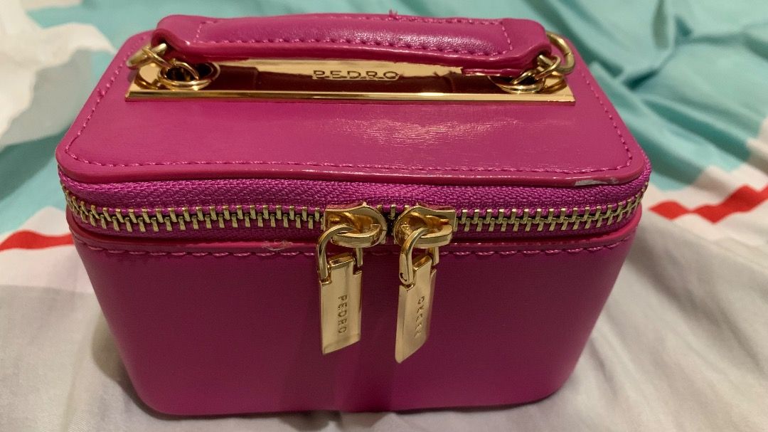 Pedro Mini Vanity Case with Sling (Category: Accessory Holder, Box & Organizers) located in Quezon City. Submitted by itscxyy (Listing ID 1460887659, Image 1). Description: - Not guaranteed authentic - Features a top handle and zip closure with two zipper pulls - Minimal flaw to the front but barely noticeable - Comes with box and detachable chain sling - Compact and portable (almost size of an Iphone 8).