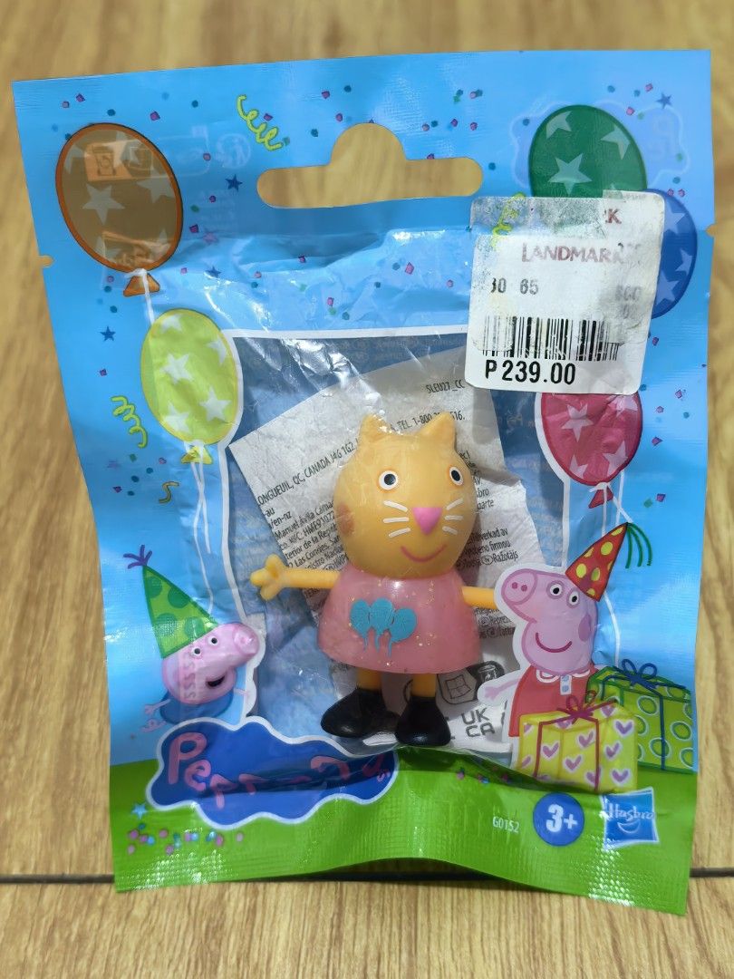 Peppa Pig Character Toy - Cat Character (Category: Kids Toys) located in Manila. Submitted by kenslie (Listing ID 1460846300, Image 1). Description: - Adorable Peppa Pig toy featuring a cat character. - Dressed in a cute pink dress. - Comes in its original, unopened packaging. - Ideal for any Peppa Pig enthusiast. - Great for collecting or imaginative play..