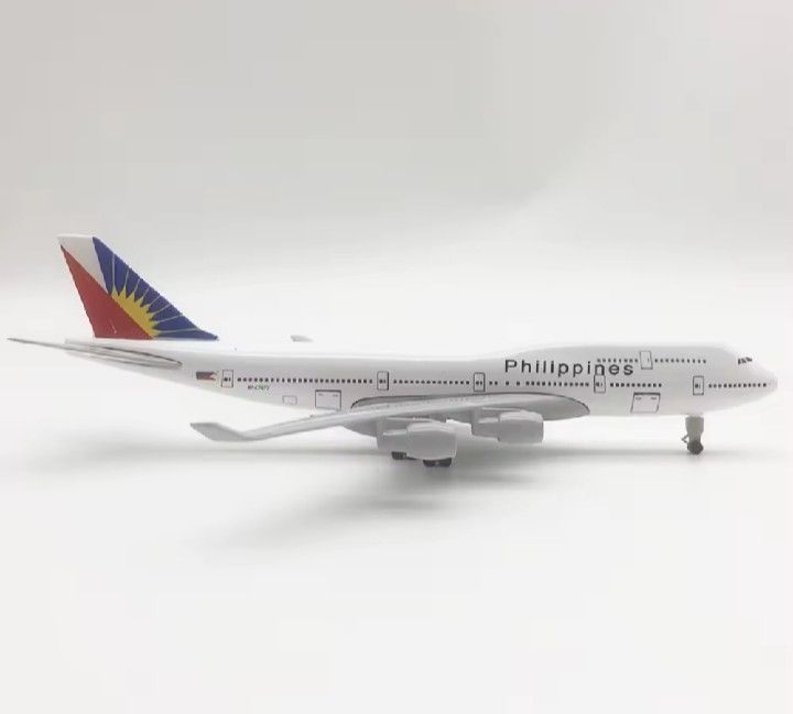 Philippines Airlines Boeing 747 Model Airplane (Category: Vehicle & Diecast Models) located in Manila. Submitted by iliasjen3082126 (Listing ID 1460770947, Image 3). Description: - Model airplane of a Philippine Airlines Boeing 747. - Features the airline name printed on the fuselage. - Includes a display stand. - Ideal for collectors or aviation enthusiasts. - Approximately [insert length if known] inches long..