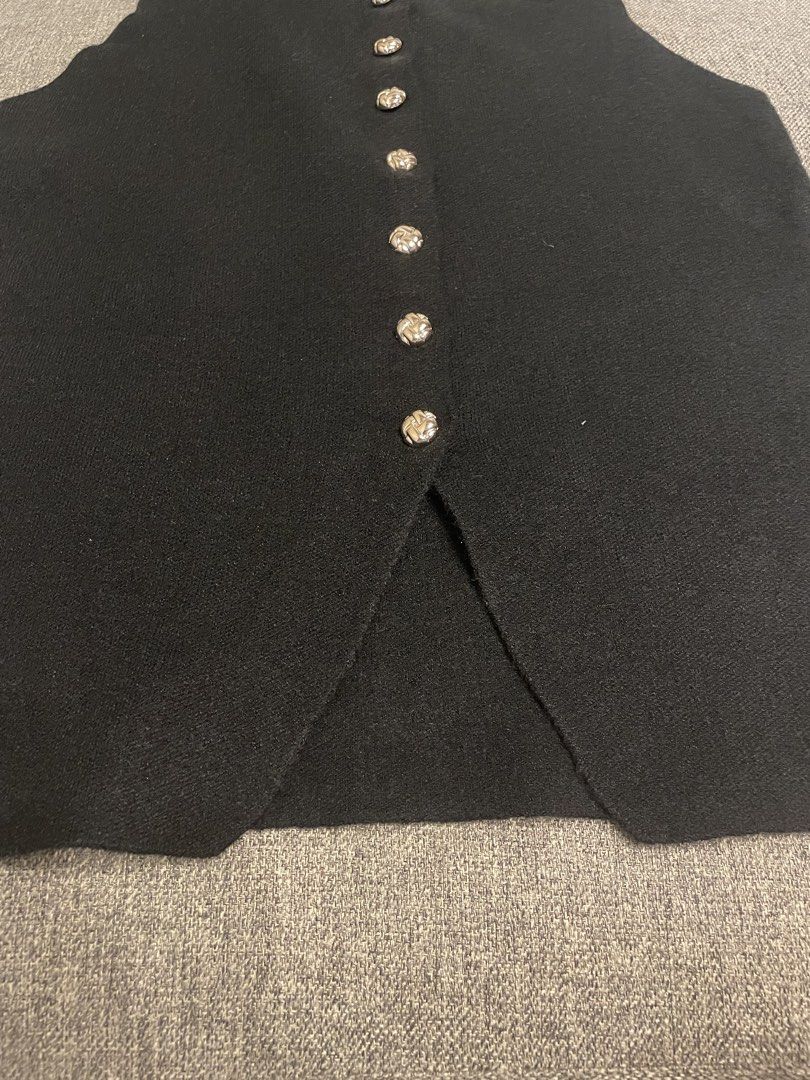 PIMM BKK Knit Button Sleeveless Vest (Category: Blouses) located in Quezon City. Submitted by mfordma (Listing ID 1460893115, Image 3). Description: BRAND NEW Originally bought for 499.00 Doing a little closet decluttering! ✨ Letting go of some pieces that are still in great condition and looking for a new home. 🤍 Brand: PIMM Size: Free size Color: Black Description: - Black knit slightly stretchable sleeveless vest - Features a row of functiona
