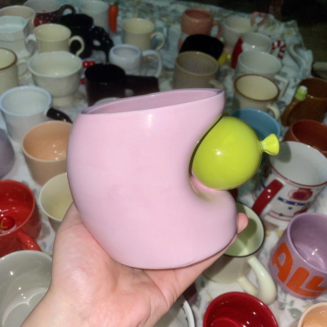 Pink Balloon Mug (Category: Coffee & Tea Tableware) located in Valenzuela. Submitted by baekhyunie_pau (Listing ID 1460805355, Image 1). Description: Cute pink mug with a unique lime green balloon detail. Perfect for coffee/tea, gifting, or personal use. Holds a good amount. (with minor crack).