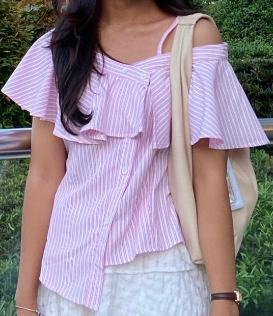 Pink Striped Off-Shoulder Ruffle Blouse (Category: Blouses) located in Pasig City. Submitted by shanbingsu (Listing ID 1460752733, Image 1). Description: asymmetrical top. mod: jnt mop: maya.