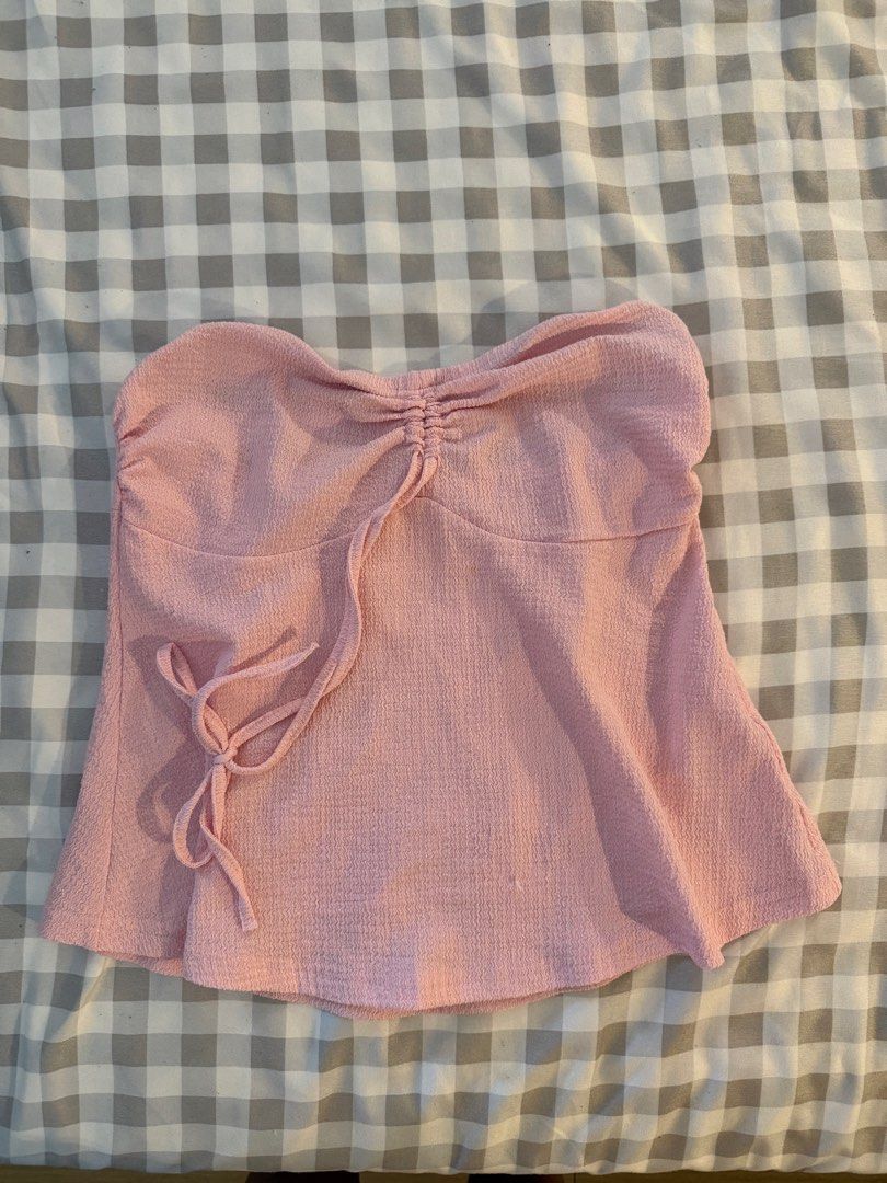Pink tube/tie halter (Category: Sleeveless) located in Muntinlupa City. Submitted by addielejano (Listing ID 1460735509, Image 1). Description: - Well-used - Garter a bit loose but still garterized - Tie for halter.