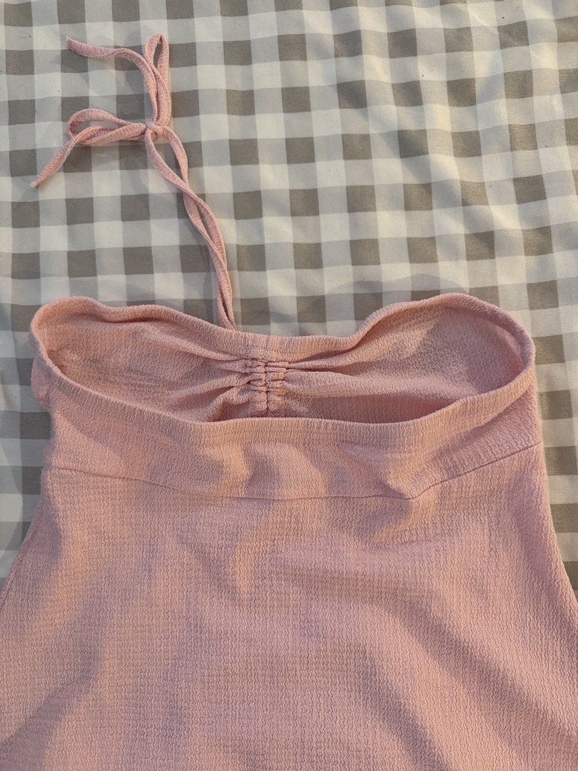 Pink tube/tie halter (Category: Sleeveless) located in Muntinlupa City. Submitted by addielejano (Listing ID 1460735509, Image 3). Description: - Well-used - Garter a bit loose but still garterized - Tie for halter.