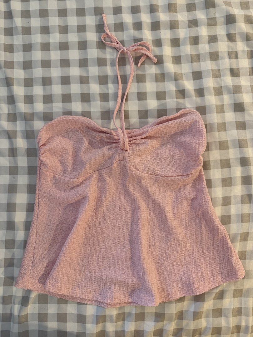 Pink tube/tie halter (Category: Sleeveless) located in Muntinlupa City. Submitted by addielejano (Listing ID 1460735509, Image 2). Description: - Well-used - Garter a bit loose but still garterized - Tie for halter.