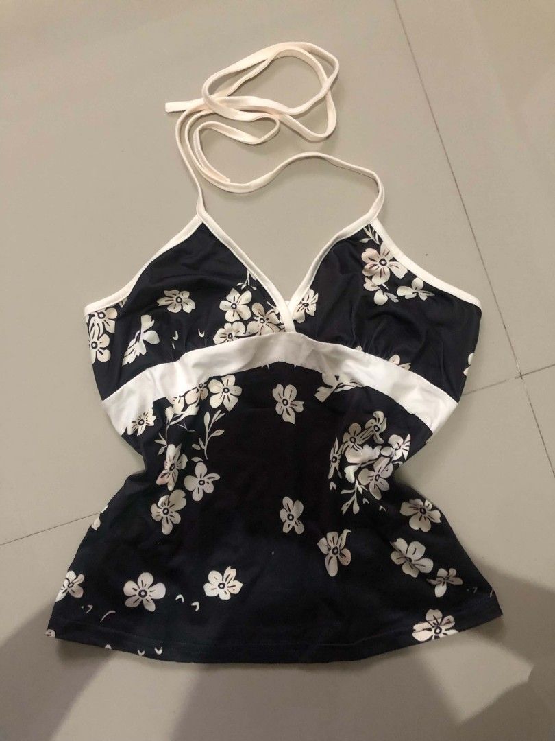 Polka Dot & Floral Halter Tops Bundle (Category: Sleeveless) located in Santa Cruz. Submitted by heynzie (Listing ID 1460810687, Image 2). Description: - Bundle of 2 cute halter tops - Navy blue halter top with white polka dots, ruffled trim, and tie-up front - Black halter top with white floral print and white trim - Both are sleeveless and have a flattering cut - Ideal for casual wear or a beach day - Worn only once (Both Top).