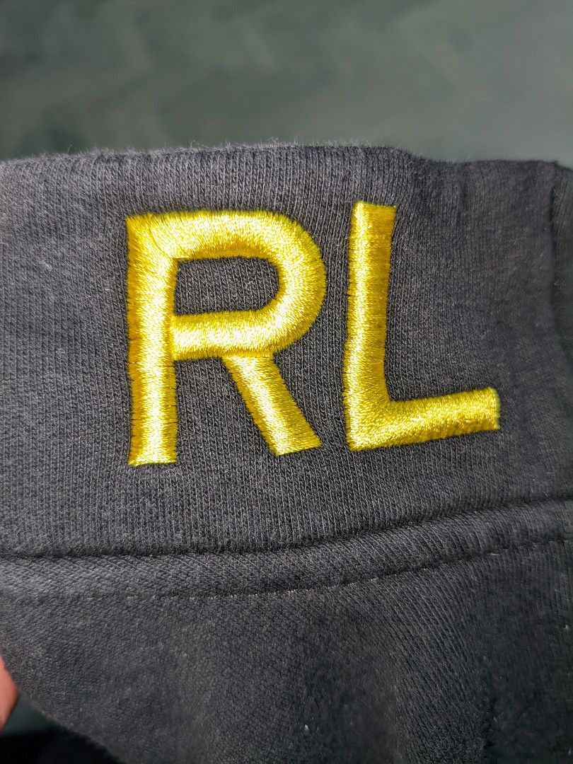 Polo Ralph Lauren RL Jacket (Category: Coats, Jackets and Outerwear) located in Caloocan City. Submitted by jrmanuel493 (Listing ID 1460827621, Image 2). Description: 25 L 22 W - Black zip-up jacket - Yellow RL logo on chest - '3' gr - 'RL' zipper pull - RN 41381 tag - Perfect for casual wear.