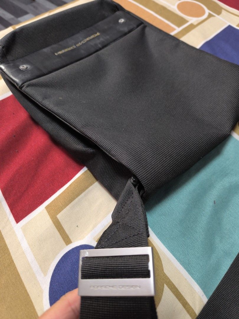 Porsche Design Black Messenger Bag (Category: Luxury Bags & Wallets) located in Caloocan City. Submitted by chefems0721 (Listing ID 1460789007, Image 2). Description: - Authentic black Porsche Design messenger bag - Made from durable material - Secure front flap closure - Adjustable strap for comfortable carrying - Multiple interior pockets for organization - Ideal for everyday use or travel.