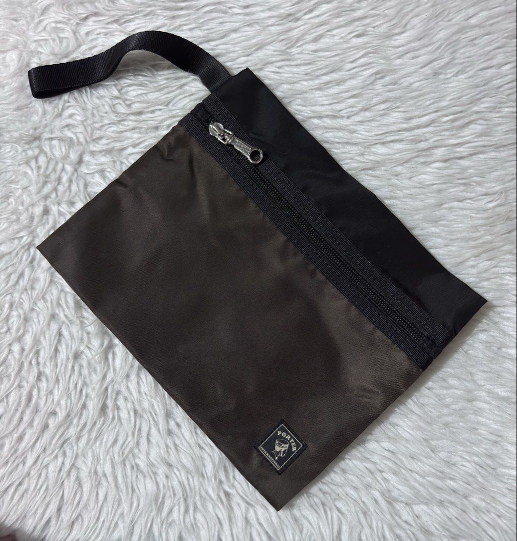Porter Double Zipper Pouch (Category: Belt bags, Clutches and Pouches) located in Paranaque City. Submitted by dalle_closet (Listing ID 1460790896, Image 3). Description: slightly used pa ito. not faded yan sa actual black & brown color.