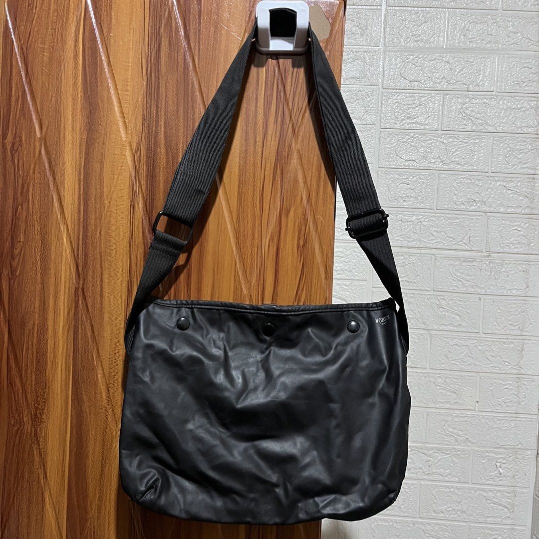 Porter Tokyo Black Messenger Bag (Category: Sling Bags) located in Carmen. Submitted by rr_thrifts (Listing ID 1460716461, Image 1). Description: - Brand: Porter Tokyo - Origin: Made in Japan - Closure: Snap button - Interior: Multiple pockets, some minor marks - Strap: Adjustable - Condition: Overall good - Ideal for: Everyday use.