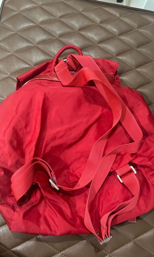 Prada Nylon Red Backpack (Category: Luxury Bags & Wallets) located in Manila. Submitted by christoph17 (Listing ID 1460816821, Image 3). Description: some flaws on leather have chips authentication not guaranteed.