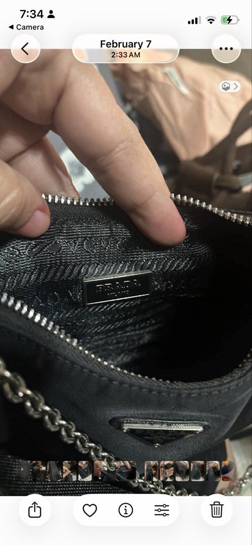 Prada Nylon Shoulder Bag with Chain Strap (Category: Luxury Bags & Wallets) located in Manila. Submitted by anjucarl (Listing ID 1460793804, Image 3). Description: - Authentic Prada shoulder bag - Black nylon material - Silver chain strap - Zipper closure - Interior features Prada logo lining - 'Made in Italy 175' tag - Ideal for everyday use.