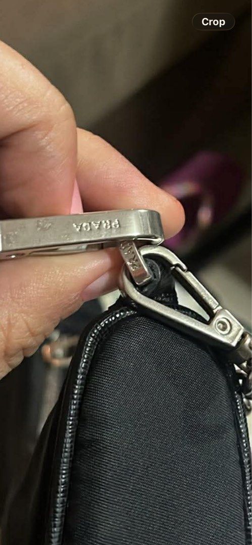 Prada Nylon Shoulder Bag with Chain Strap (Category: Luxury Bags & Wallets) located in Manila. Submitted by anjucarl (Listing ID 1460793804, Image 2). Description: - Authentic Prada shoulder bag - Black nylon material - Silver chain strap - Zipper closure - Interior features Prada logo lining - 'Made in Italy 175' tag - Ideal for everyday use.