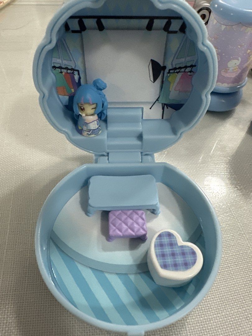 Precure gacha (Category: Kids Toys) located in Manila. Submitted by lunalux09 (Listing ID 1460810629, Image 1). Description: - Adorable blue cloud-shaped playset. - Comes with a cute doll with blue hair. - Includes miniature furniture: a table and a heart-shaped box. - Opens up to reveal a fashion studio scene. - Features clothes racks and a backdrop for creative play. - Encourages imaginative and pretend play..