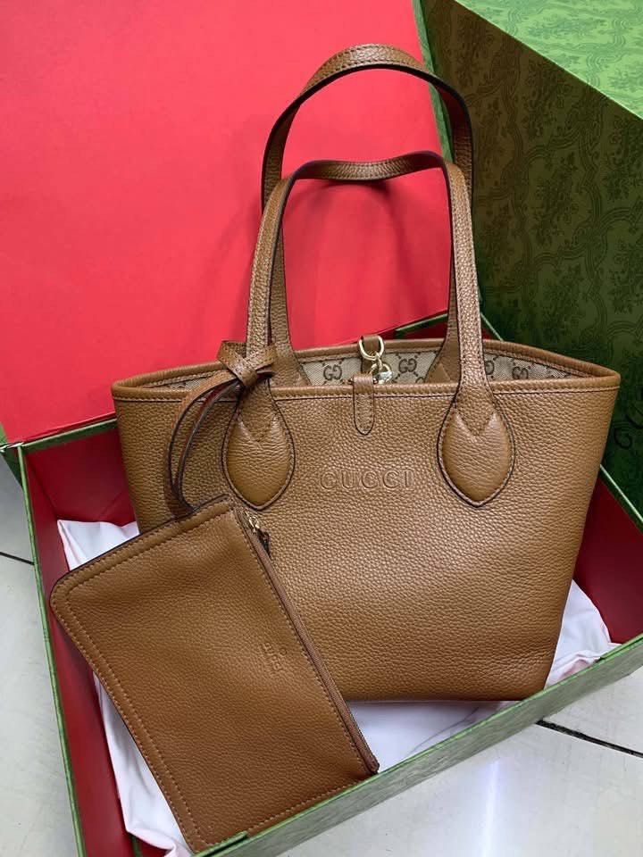 Preloved GG Vintage Reversible Tote (Category: Luxury Bags & Wallets) located in Manila. Submitted by bagsandmanymanymore1 (Listing ID 1460729536, Image 1). Description: Preloved GG Canvas Tote Reversible Bag Size 30cm Actual photos posted Please read before you order 👉🏻❗️Payment first before shipping ❗️Cut off time of payment 11am sameday delivery ❗️NO MEET UP / NO PICK UP ❗️ORDER CANNOT BE CANCELLED ❗️PLEASE DON’T BUY IF YOU ARE IN DOUBT ❗️NO