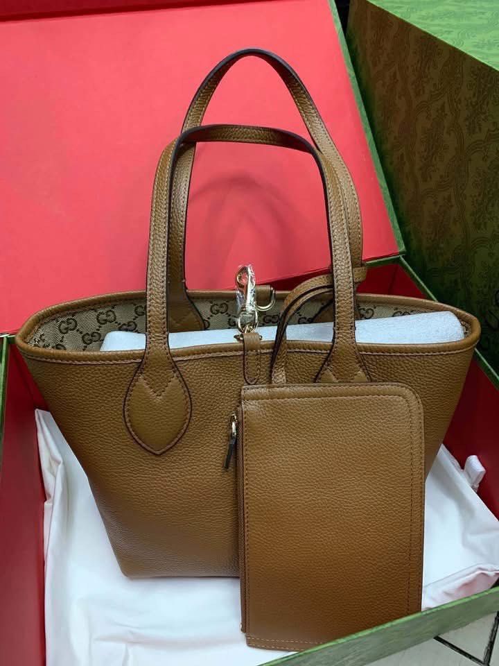 Preloved GG Vintage Reversible Tote (Category: Luxury Bags & Wallets) located in Manila. Submitted by bagsandmanymanymore1 (Listing ID 1460729536, Image 2). Description: Preloved GG Canvas Tote Reversible Bag Size 30cm Actual photos posted Please read before you order 👉🏻❗️Payment first before shipping ❗️Cut off time of payment 11am sameday delivery ❗️NO MEET UP / NO PICK UP ❗️ORDER CANNOT BE CANCELLED ❗️PLEASE DON’T BUY IF YOU ARE IN DOUBT ❗️NO