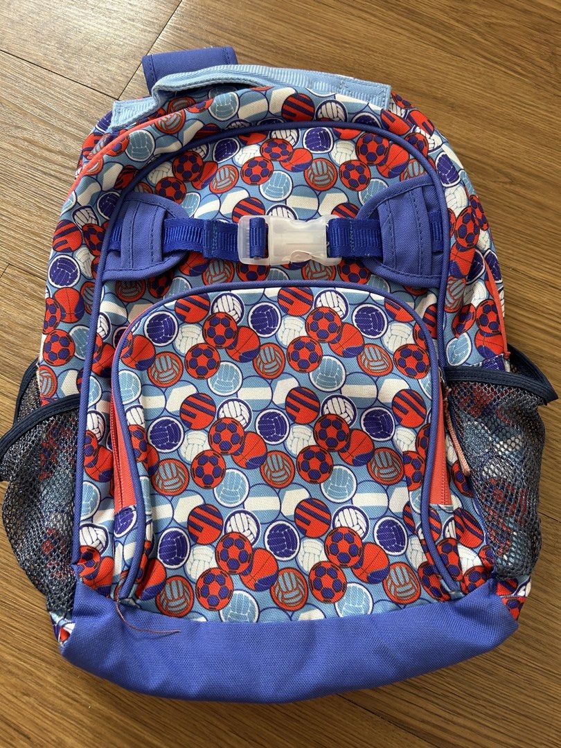 Preloved Lily and Tucker Backpack (Category: Babies & Kids Fashion) located in Pililla. Submitted by momshk (Listing ID 1460751520, Image 1). Description: - Fun backpack with colorful soccer and volleyball print. - Front zippered pocket for easy access. - Side mesh pockets perfect for water bottles. - Comfortable padded shoulder straps. - Main compartment with internal pockets for organization. - Note: Some light marks inside the main compartment