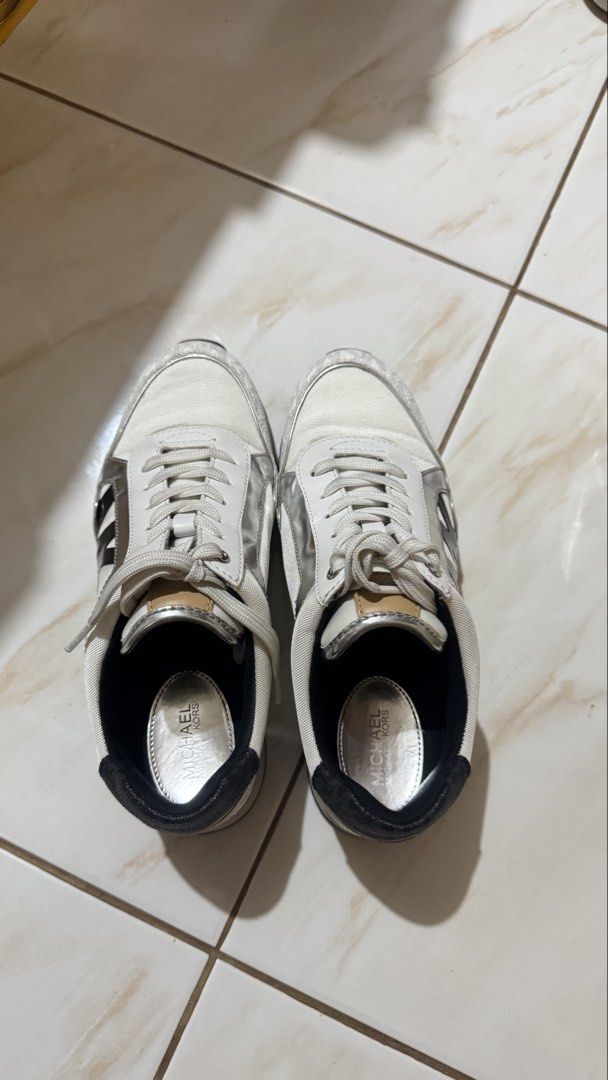 PRELOVED MICHAEL KORS MK LOGO SNEAKERS (Category: Sneakers) located in Pasig City. Submitted by lalalagorg (Listing ID 1460789132, Image 2). Description: Decluttering my Michael Kors MK Logo Sneakers 🤍✨ Classic white/cream with silver metallic details and the signature MK logo — easy to pair with casual outfits! ✨ Authentic Michael Kors ✨ White/cream + silver colorway ✨ Signature MK logo detail ✨ Comfortable everyday sneakers ✨ Preloved Conditio