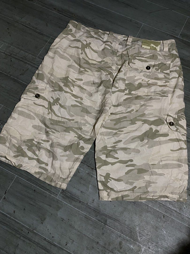 Puma Camo Cargo Shorts (Category: Shorts) located in Davao. Submitted by singkorayk15407 (Listing ID 1460903636, Image 2). Description: - Cool Puma camouflage cargo shorts - Multiple pockets for ample storage - Secure button and zip fly closure - Ideal for casual wear and outdoor adventures - Designed for a comfortable fit.