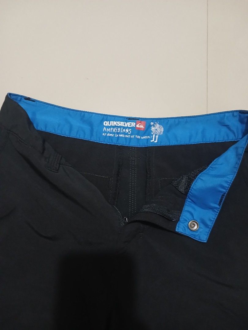 Quiksilver Amphibious Board Shorts Black (Category: Shorts) located in Valencia. Submitted by mahartinmo19925 (Listing ID 1460918650, Image 2). Description: - Black Quiksilver board shorts - Amphibious style: great for water or casual wear - Blue waistband lining - Button and zip closure - Two side pockets - One back pocket - Ideal for the beach or everyday use.
