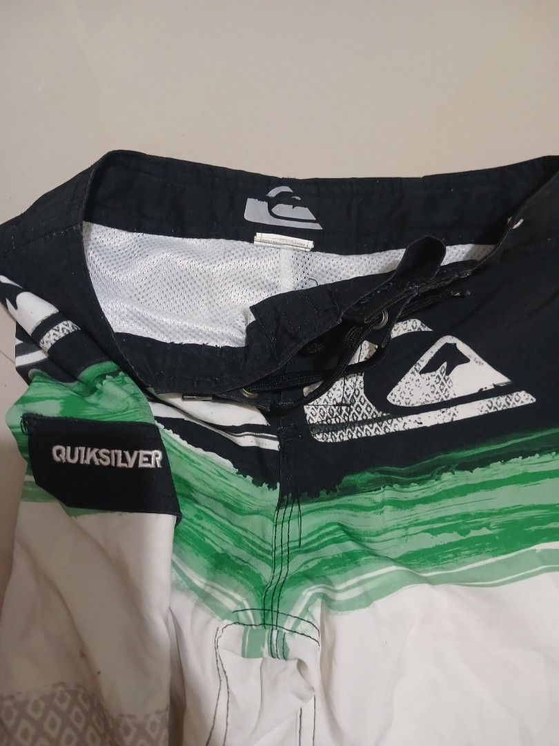 Quiksilver Board Shorts (Category: Babies & Kids Fashion) located in Valencia. Submitted by mahartinmo19925 (Listing ID 1460918705, Image 2). Description: - Quiksilver board shorts - Cool black, white, and green design - Features the iconic Quiksilver logo - Adjustable drawstring waist for a comfortable fit - Ideal for beach days, pool parties, or any water adventure - Ready for your next adventure!.