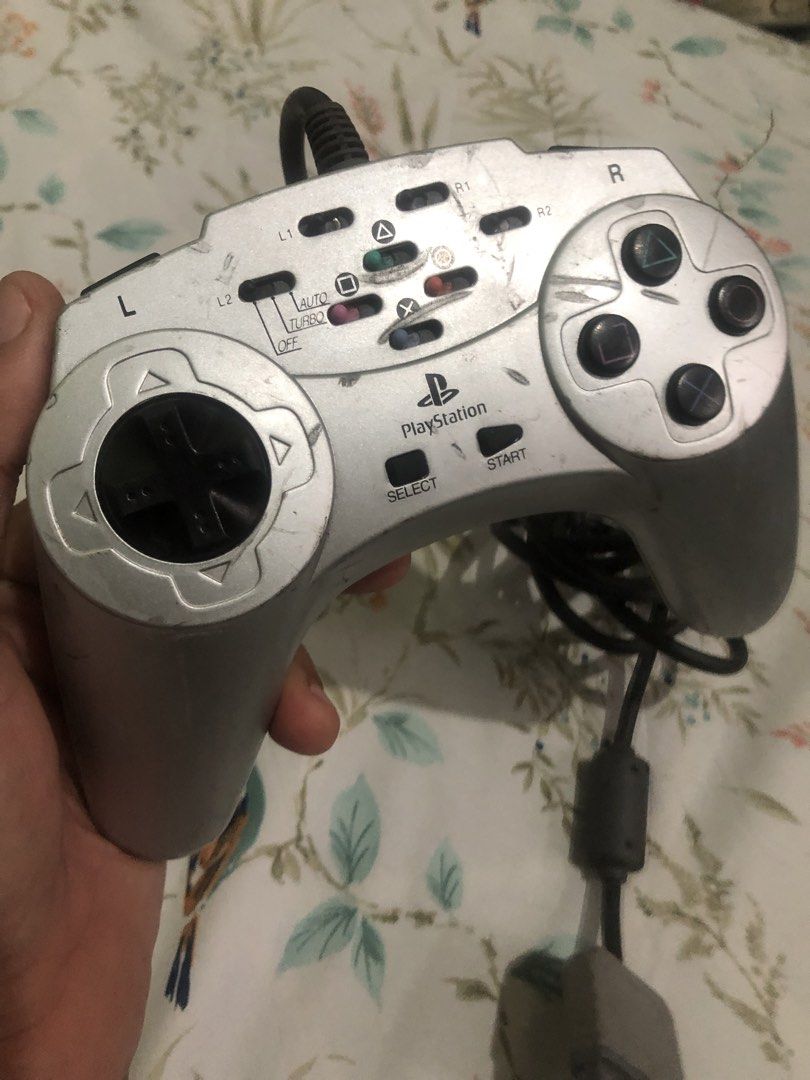 Rare PS1 turbo controller V2 (Category: Controllers) located in Quezon City. Submitted by markgolveo (Listing ID 1460745062, Image 2). Description: Rare PS1 turbo controller V2 Tested working properly All buttons analogs and switches working properly Auto buttons and turbo functions all works propely Signs of wears on shell case as shown on images.