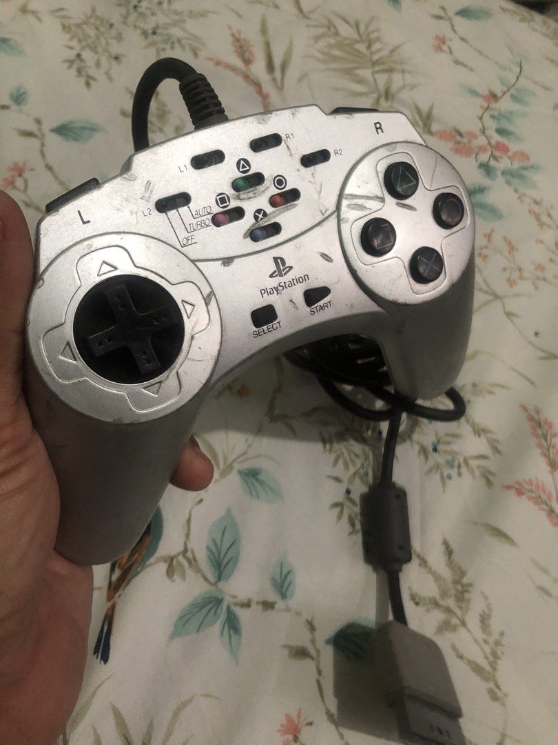 Rare PS1 turbo controller V2 (Category: Controllers) located in Quezon City. Submitted by markgolveo (Listing ID 1460745062, Image 3). Description: Rare PS1 turbo controller V2 Tested working properly All buttons analogs and switches working properly Auto buttons and turbo functions all works propely Signs of wears on shell case as shown on images.