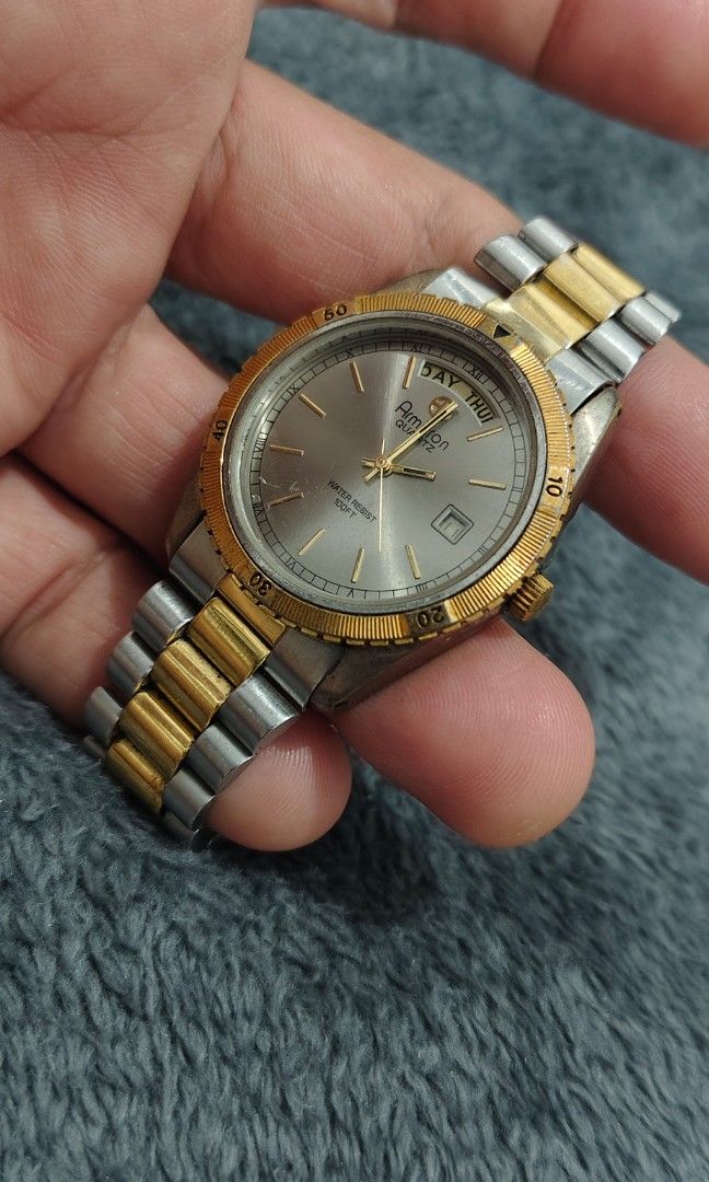 Rare Vintage Amitron President (Category: Men's Watches) located in Cebu City. Submitted by aceoftime (Listing ID 1460908379, Image 2). Description: Im good condition Japanese analog quartz with presidential configuration day-date display Beautifu fluted bezel details Silver sunburst dial with gold accent indices Watch only Our Guarantee: 💯 Authentic All watches are checked by our experienced technician to ensure good functionality Please manage
