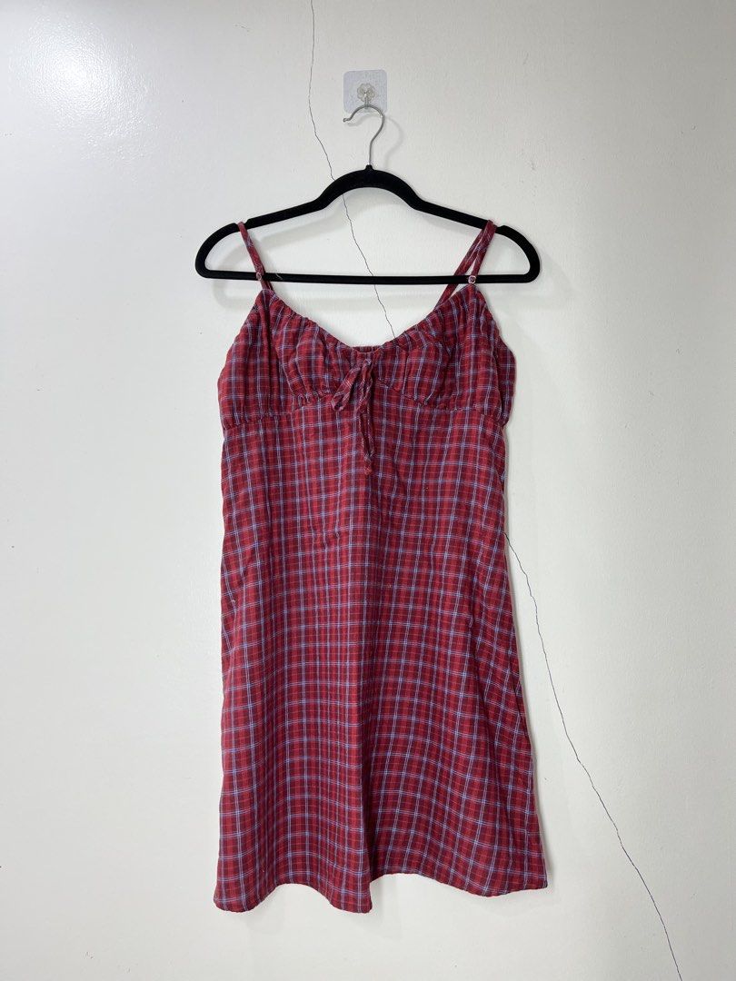 Red Plaid Mini Dress with Tie Front (Category: Dresses) located in Pakil. Submitted by roserarela (Listing ID 1460741867, Image 2). Description: - Cute red plaid mini dress - Adjustable spaghetti straps - Tie detail at the bust - Lightweight fabric - Subtle blue plaid pattern - Ideal for casual outings or layering.