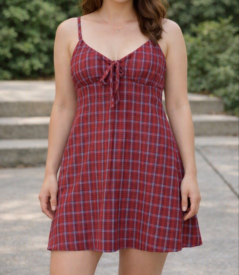 Red Plaid Mini Dress with Tie Front (Category: Dresses) located in Pakil. Submitted by roserarela (Listing ID 1460741867, Image 1). Description: - Cute red plaid mini dress - Adjustable spaghetti straps - Tie detail at the bust - Lightweight fabric - Subtle blue plaid pattern - Ideal for casual outings or layering.