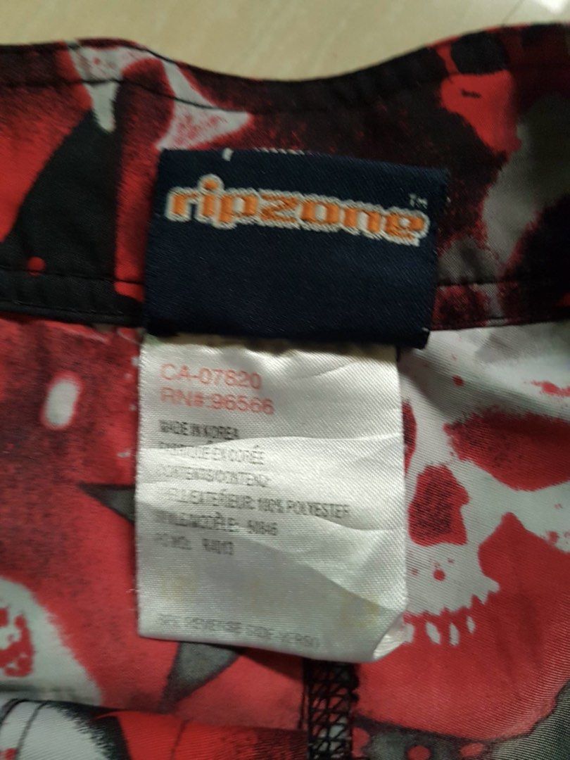 Ripzone Skull & Crossbones Board Shorts Size 32 (Category: Swim Trunks & Board Shorts) located in Bauang. Submitted by drie_02 (Listing ID 1460778393, Image 2). Description: - Ripzone board shorts - Size 32 - Edgy red, black, and white skull and crossbones print - Made in Korea - 100% polyester - Ideal for swimming or lounging - Drawstring waist for adjustable fit.