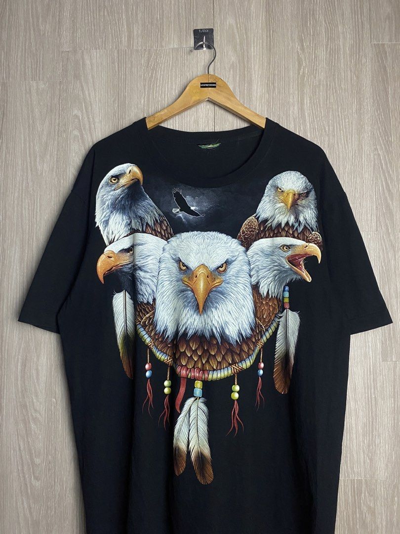 ROCK EAGLE WRAP AROUND TEE (Category: Tshirts & Polo Shirts ) located in Marikina City. Submitted by ilayastreetarchives_ (Listing ID 1460862643, Image 2). Description: ROCK EAGLE WRAP AROUND TEE Size tagged: N/A (XL/XXL fit) Width/Waist: 25 Length: 30 Condition: 9.5/10 (excellent) Issue: None / cut tag Color rate: 9.5/10 M/mine: 510 PHP.