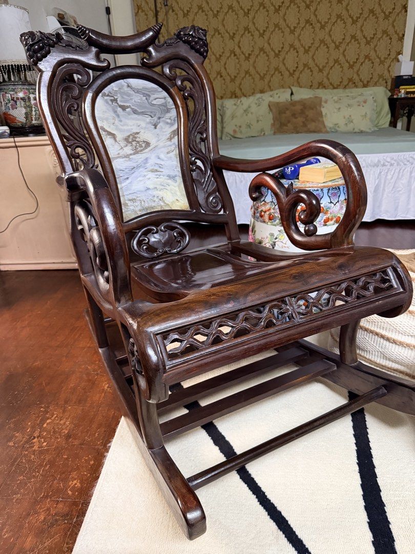 Rocking chair (Category: Chairs) located in Quezon City. Submitted by redcherry131 (Listing ID 1460866081, Image 2). Description: Vietnam Rosewood with marble back. Intricate rose flower design. Custom made. Very thick solid wood. Very beautiful in person. .